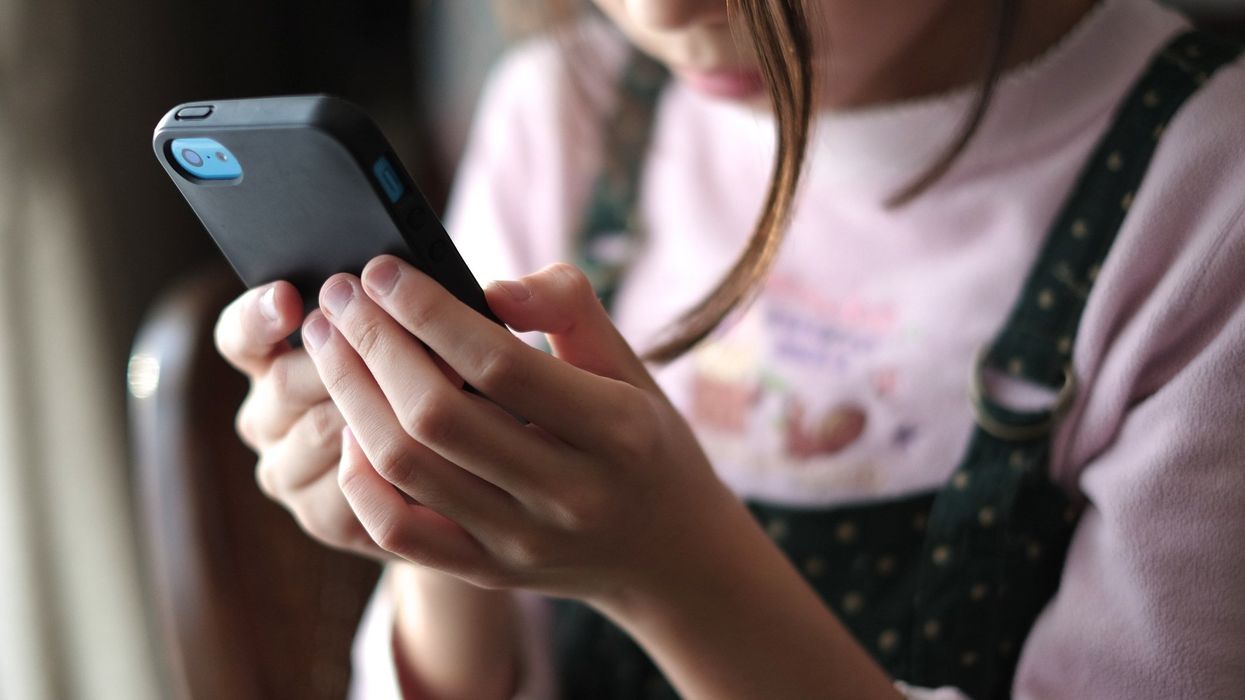 child holding smartphone