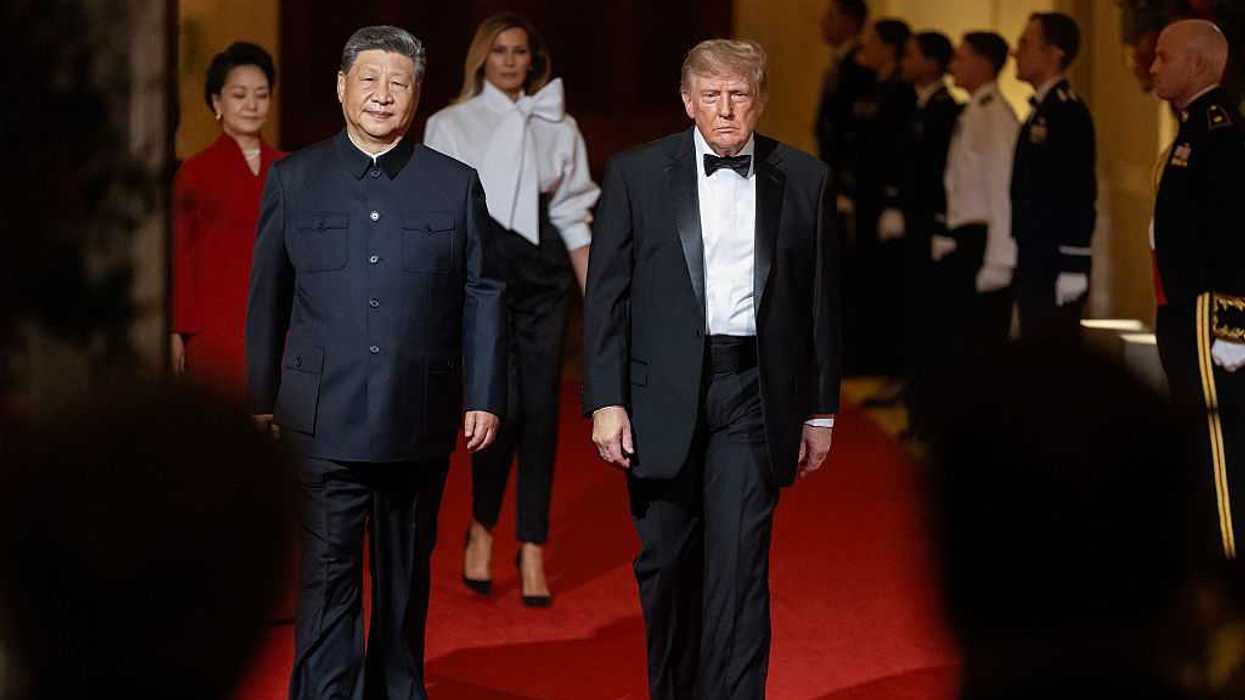 Chinese President Xi Jinping (L) and U.S. President Donald Trump followed by Chinese first lady Peng Liyuan and U.S. first lady Melania Trump arrive for a state dinner at the White House.