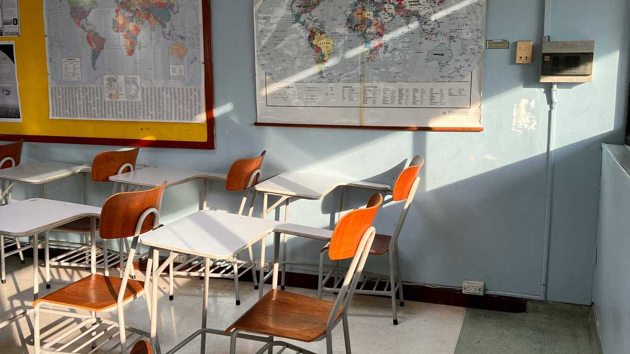 classroom with a map hanging on the wall