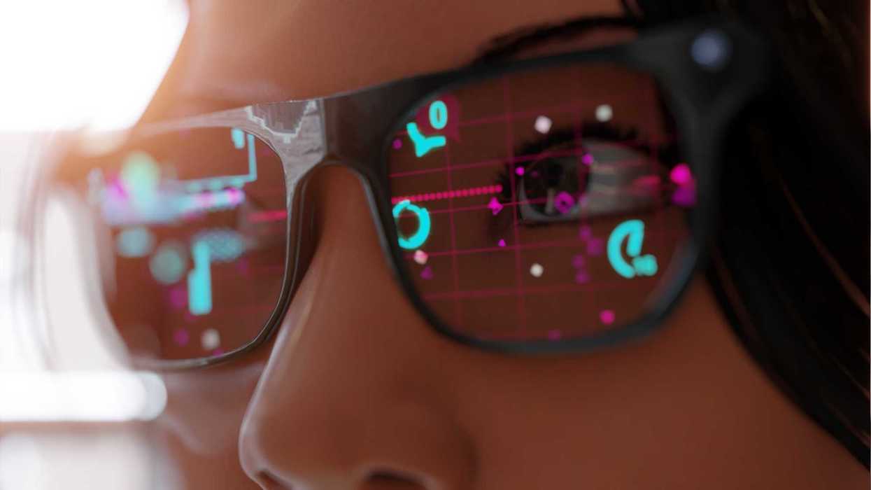 Close up of a woman wearing black, modern spectacles Smart glasses and reality concept with futuristic screen