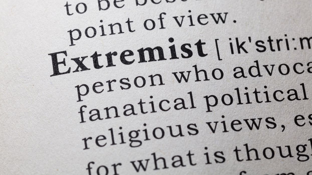 Close-up of dictionary definition of extremism