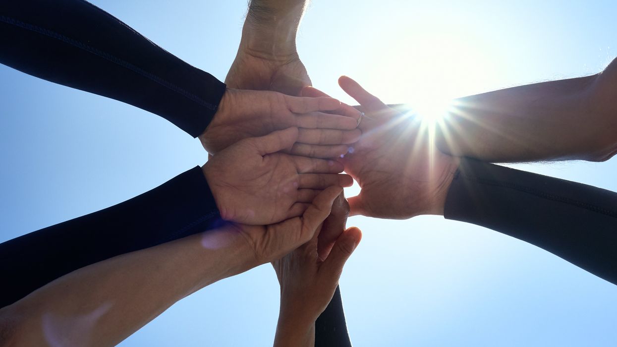Close up of people holding hands