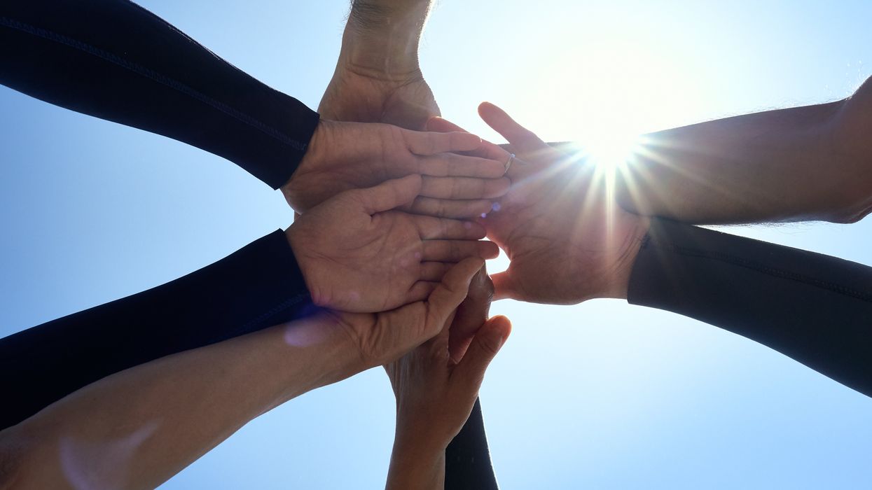 Close up of people holding hands