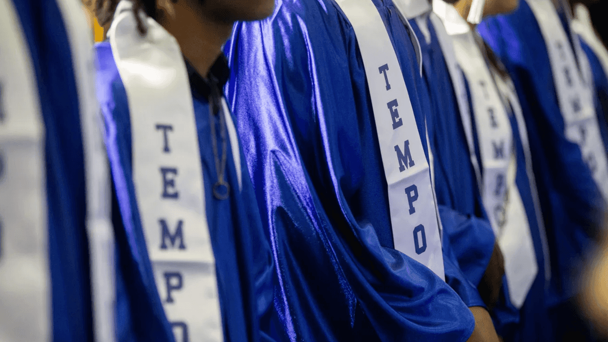 Close up of people in graduate gowns.