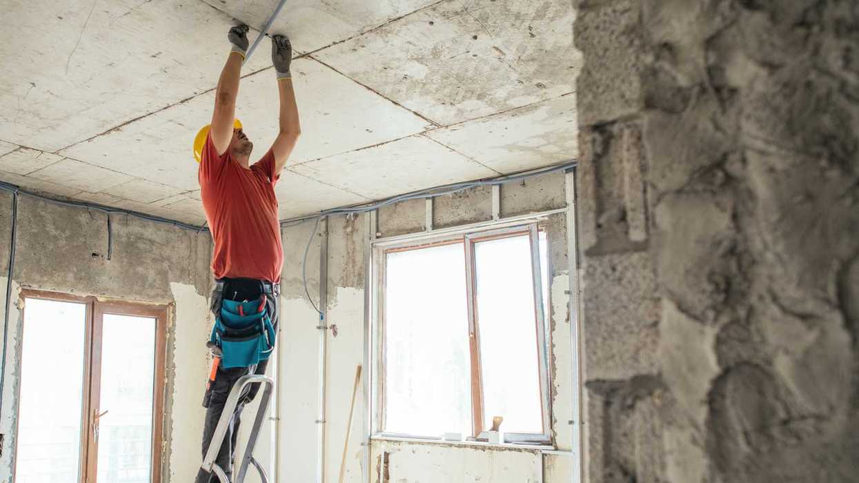 Creative Images & Video Creative Images & Video Images Creative Editorial Video Creative Editorial Search by image or video Electrician working at a construction site during home or apartment renovation, repair or reconstruction.