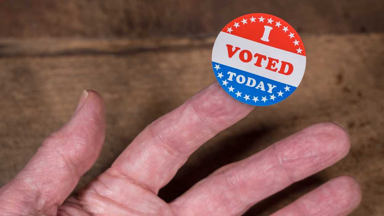 Creative Images & Video Creative Images & Video Images Creative Editorial Video Creative Editorial Search by image or video I Voted Today paper sticker on mans finger on rustic wooden table