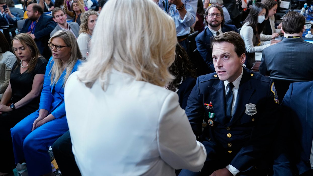 D.C. Police Officer Daniel Hodges shakes hands with Rep. Liz Cheney at a hearing