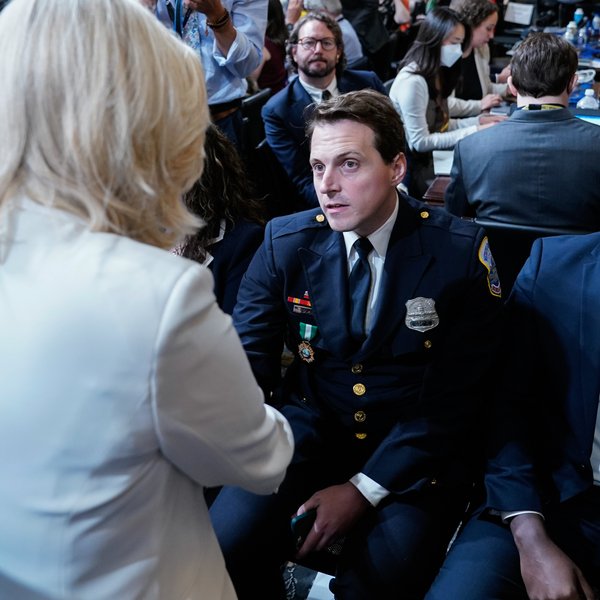 D.C. Police Officer Daniel Hodges shakes hands with Rep. Liz Cheney at a hearing