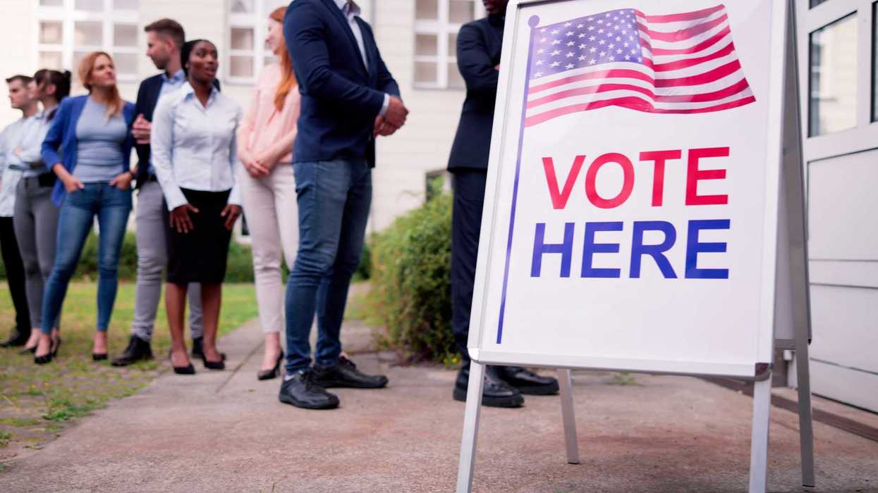 Diverse People At Voting Booth. Vote Here Elections Sign