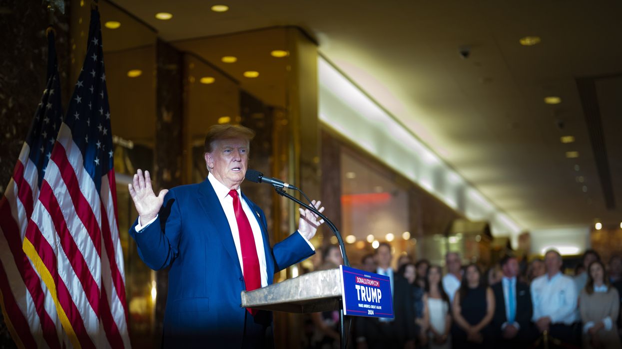 Donald Trump speaking at a podium