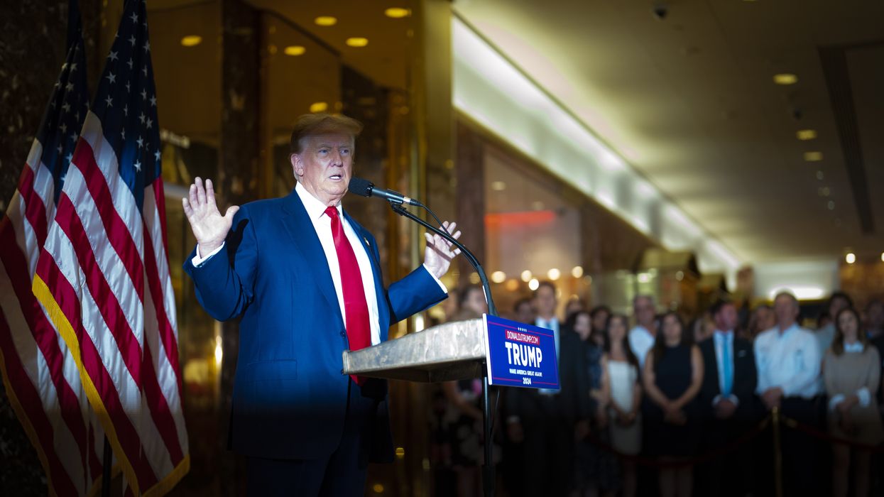 Donald Trump speaking at a podium