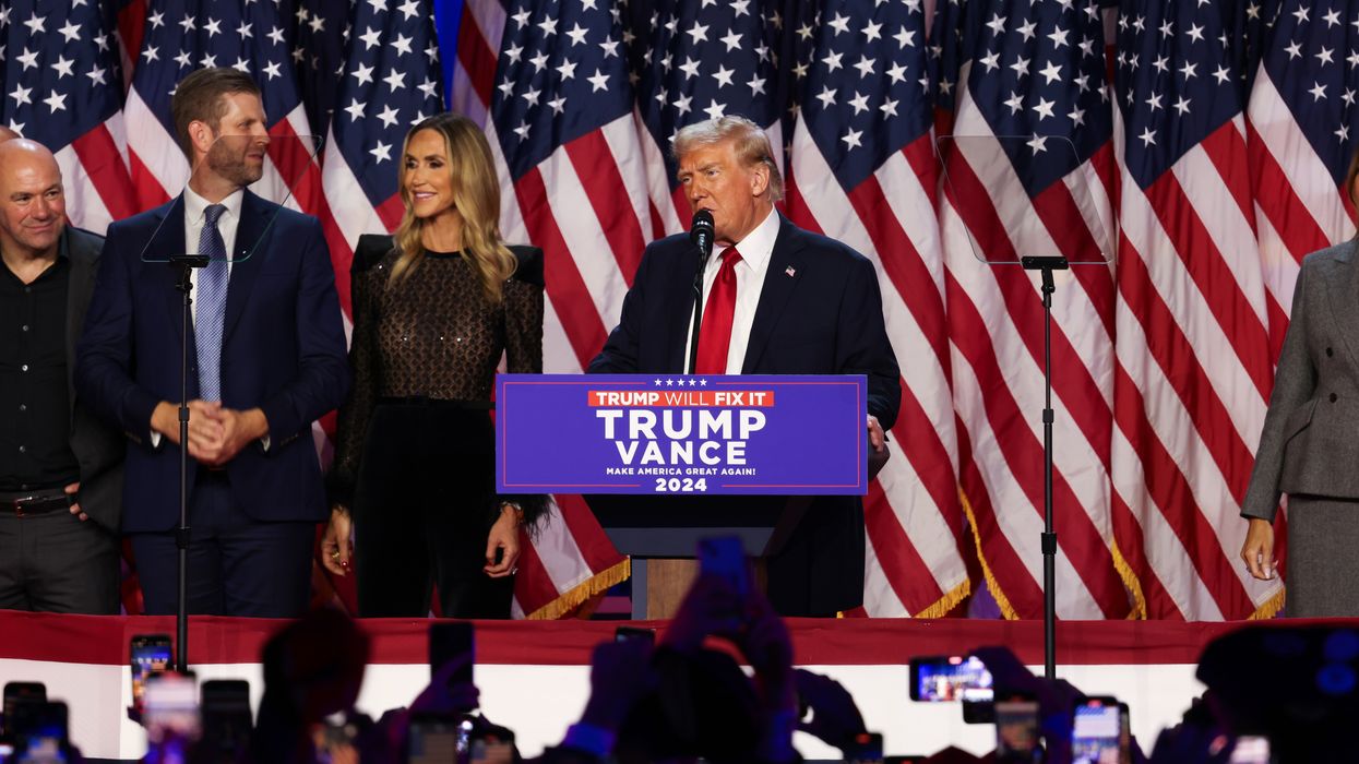 Donald Trump speaking at a podium