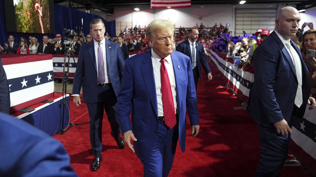 Donald Trump walking past a crowd of supporters