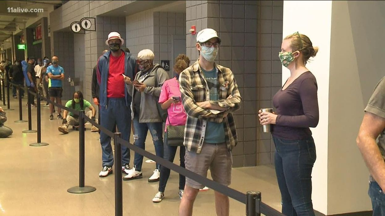 Why long lines in early voting may signal voter suppression