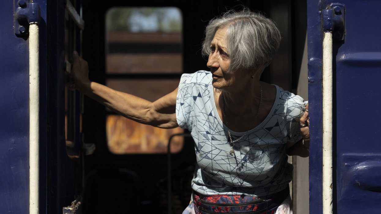 Elderly woman on a train