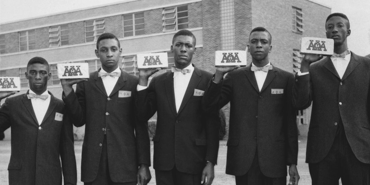 Five Black men holding their Alpha Phi Alpha cards