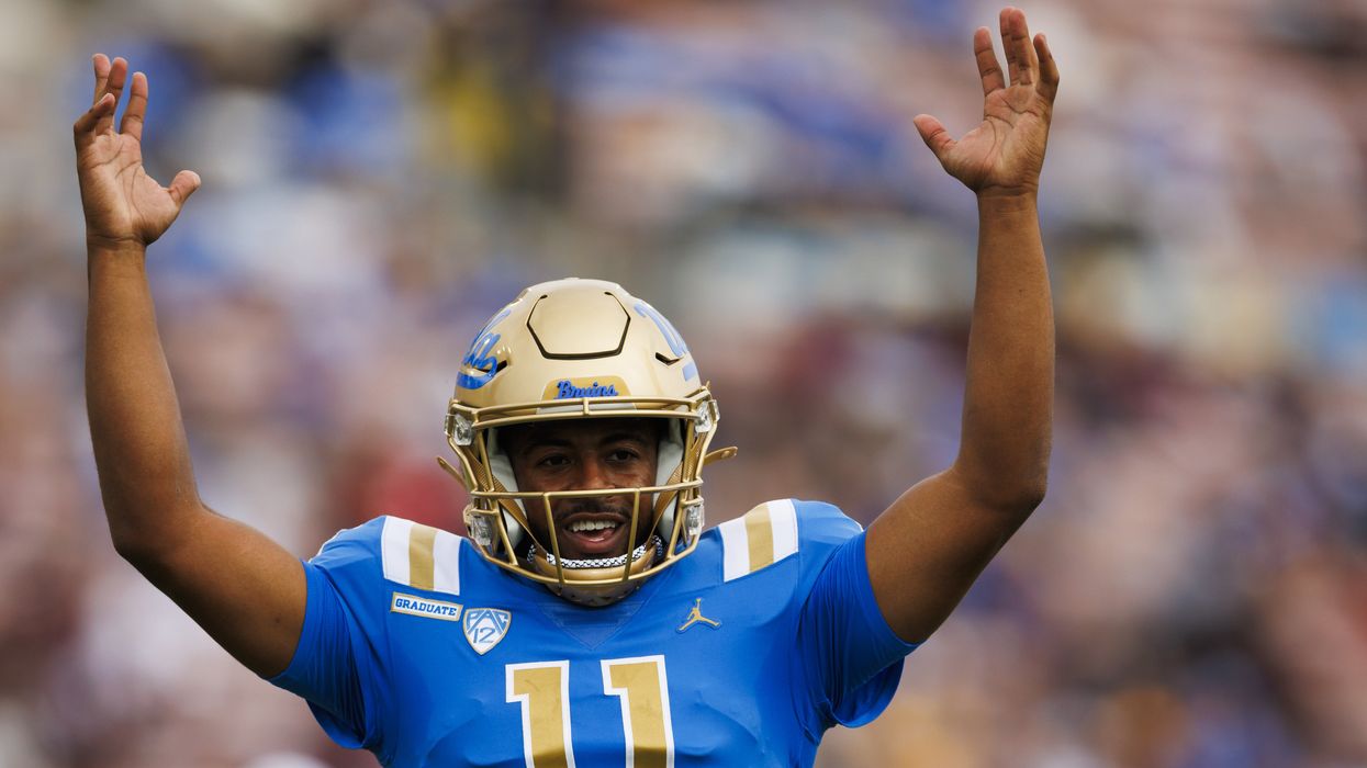 Football player signaling "Touchdown"