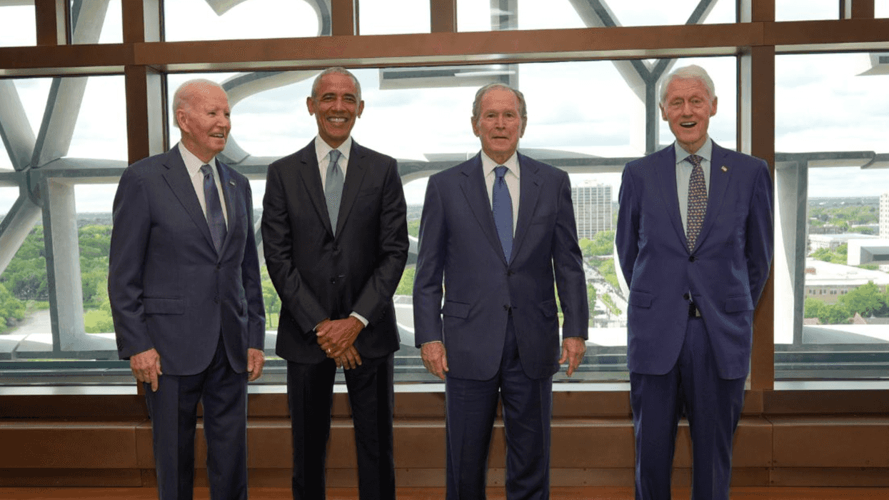 Former President Joe Biden, former President Barack Obama, former President George W. Bush, and former President Bill Clinton pose together.