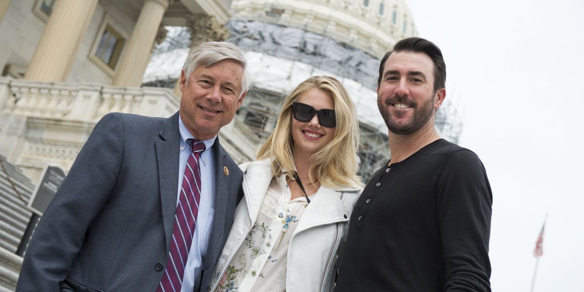 Former Rep. Fred Upton, model Kate Upton and baseball pitcher Justin Verlander pose outside the Capitol