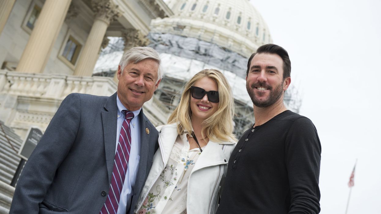 Former Rep. Fred Upton, model Kate Upton and baseball pitcher Justin Verlander pose outside the Capitol