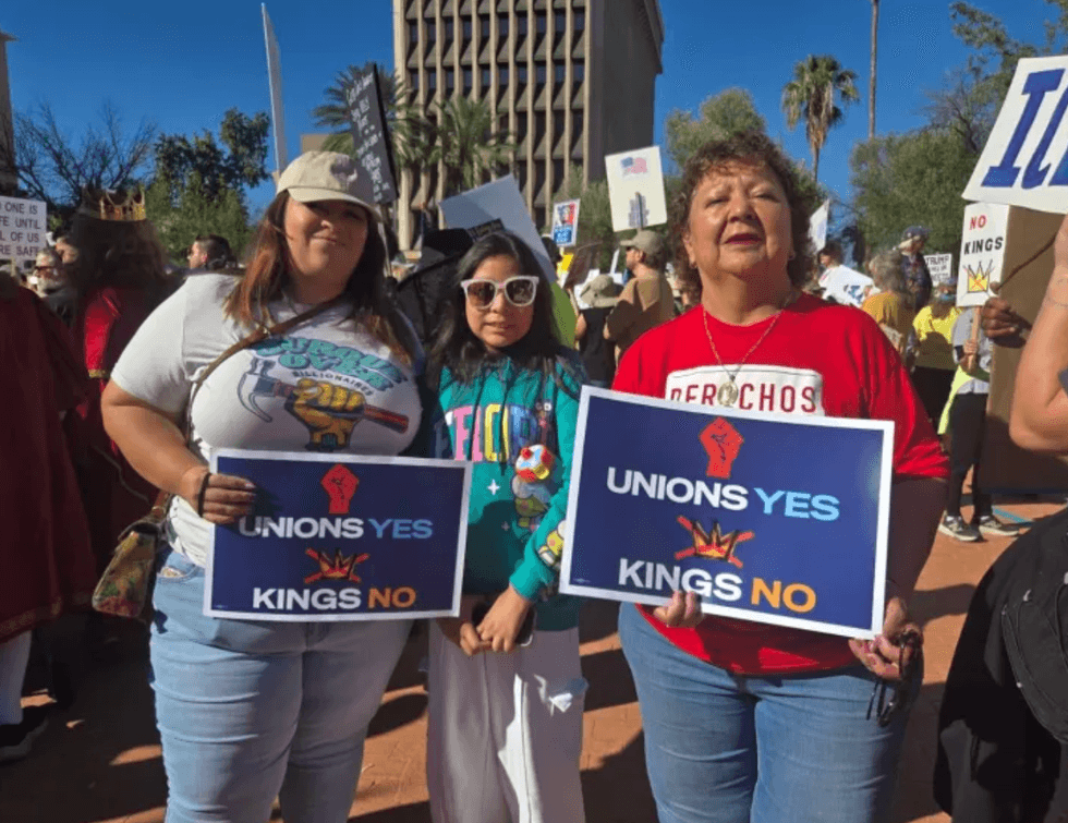 From left: Martha Reyes, Arizona Jobs with Justice organizer, and her daughter Jimena Reyes, alongside Cecilia Valdez, chair of the Pima Area Labor Federation, represent workers at the \u201cNo Kings\u201d rally in downtown Tucson