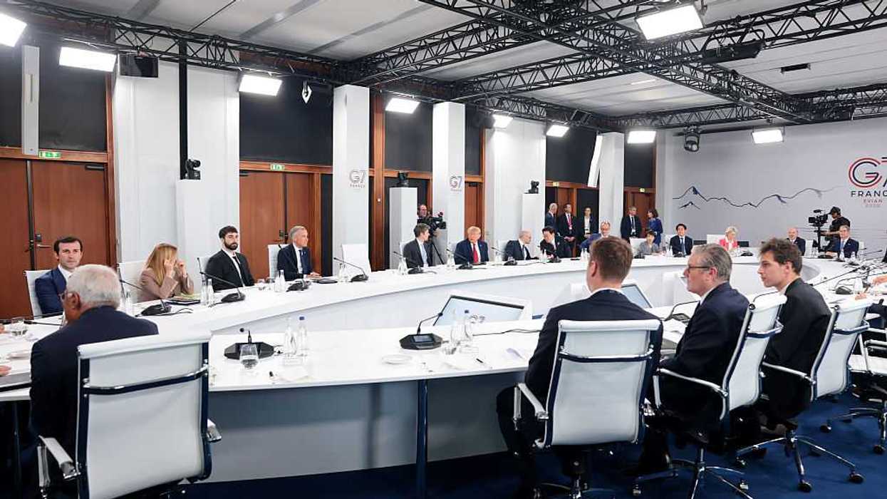 Global leaders sitting around a circular table at the G7 Summit on June 18, 2026.