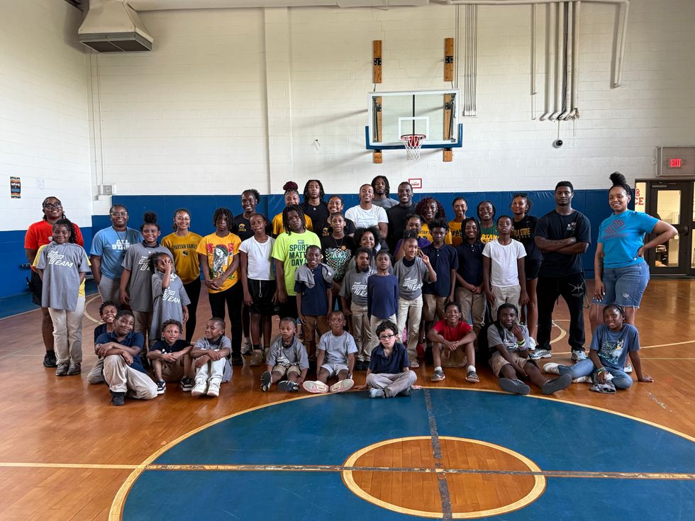 group of people in a basketball gym