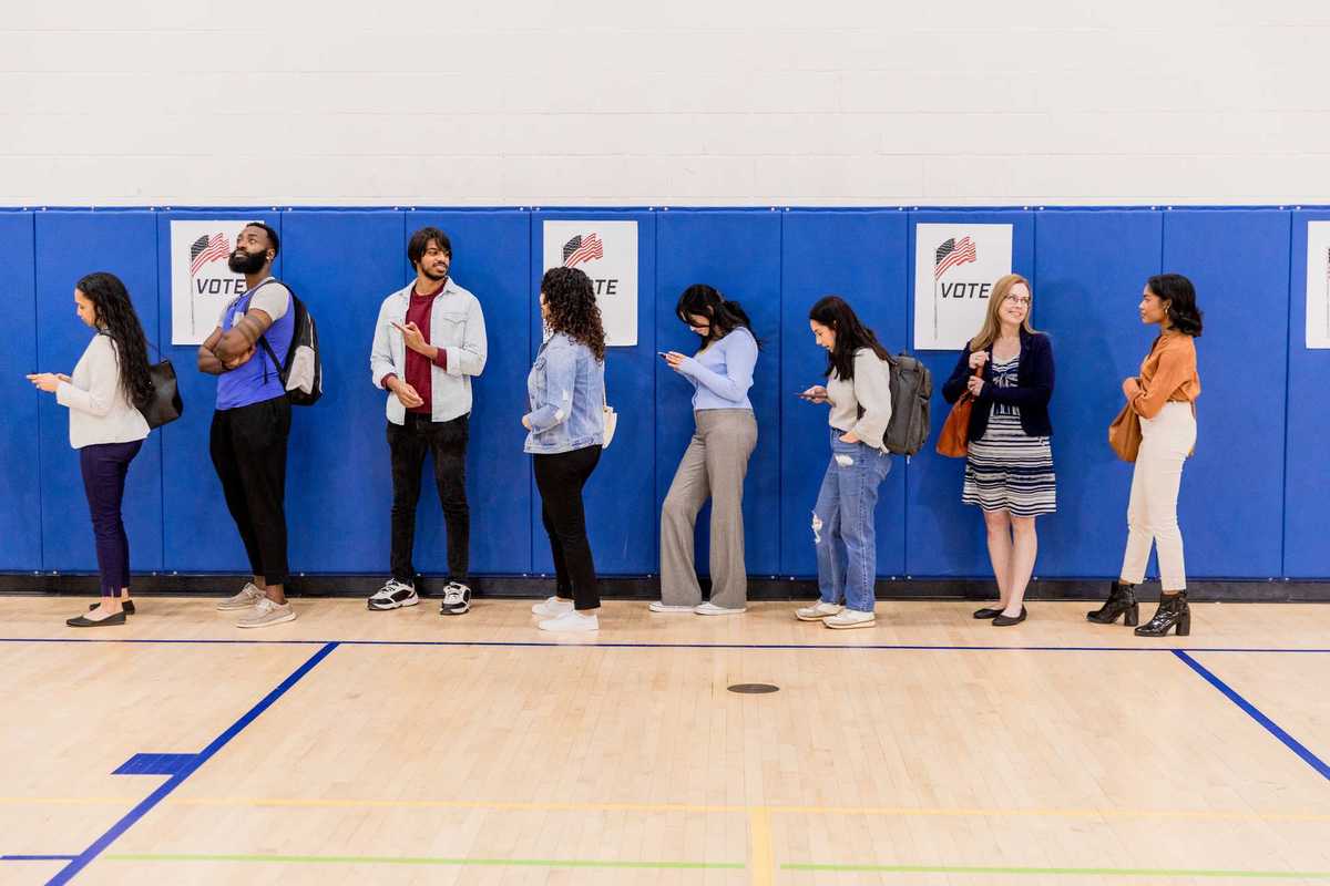 Group of voters stand in line
