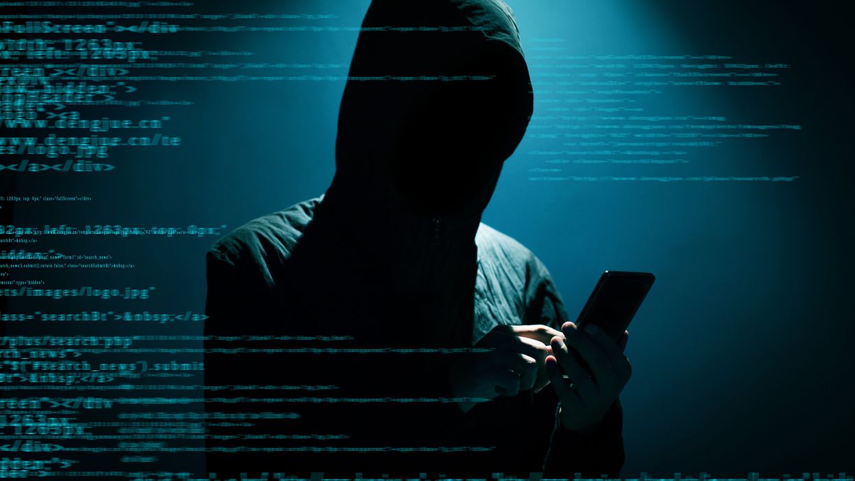 Hacker on smartphone