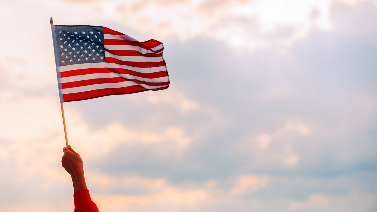 Hand waving an American flag