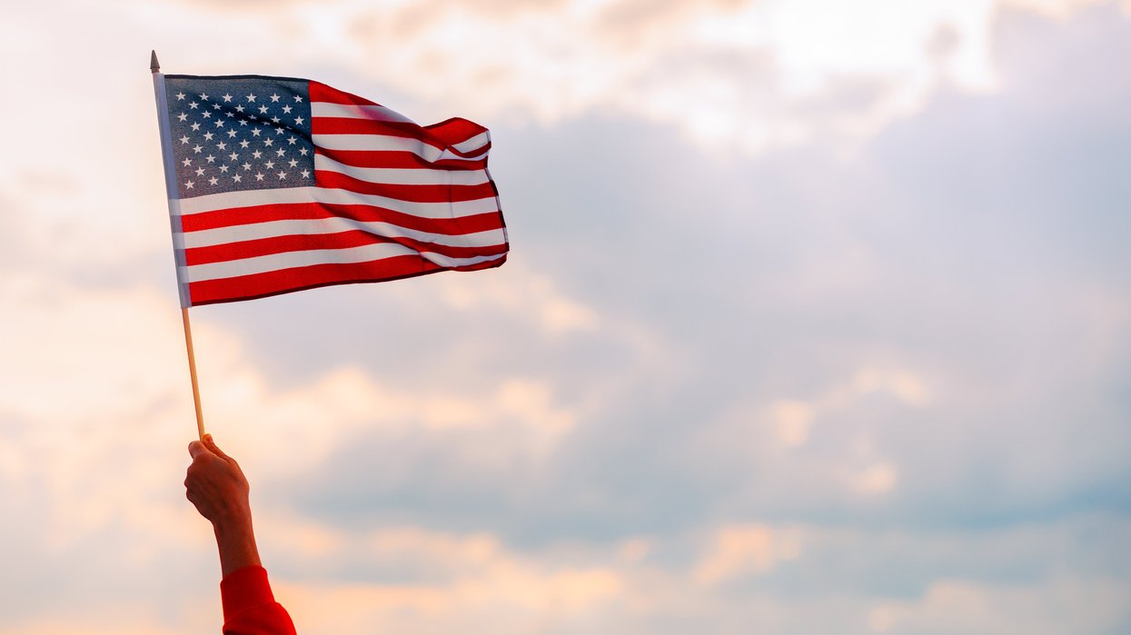 Hand waving an American flag