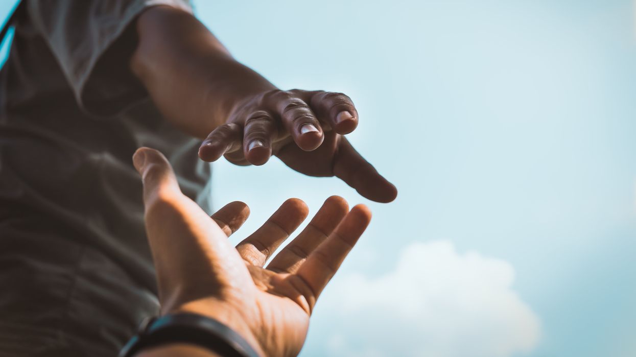 Hands reaching for each other