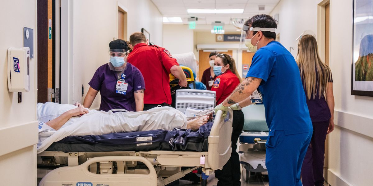 Health care workers in a crowded hospital corridor