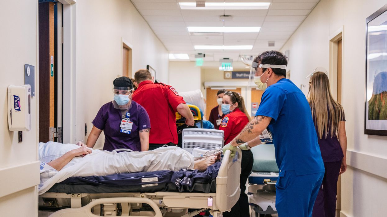 Health care workers in a crowded hospital corridor