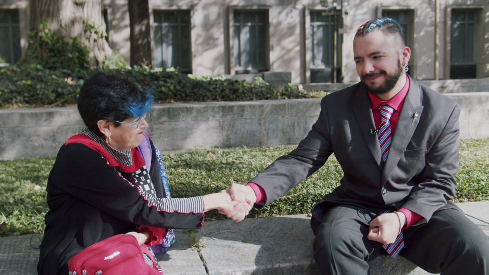 Heather Shaner (left) shakes hands with her client and Jan. 6 defendant Jack Griffith (right)