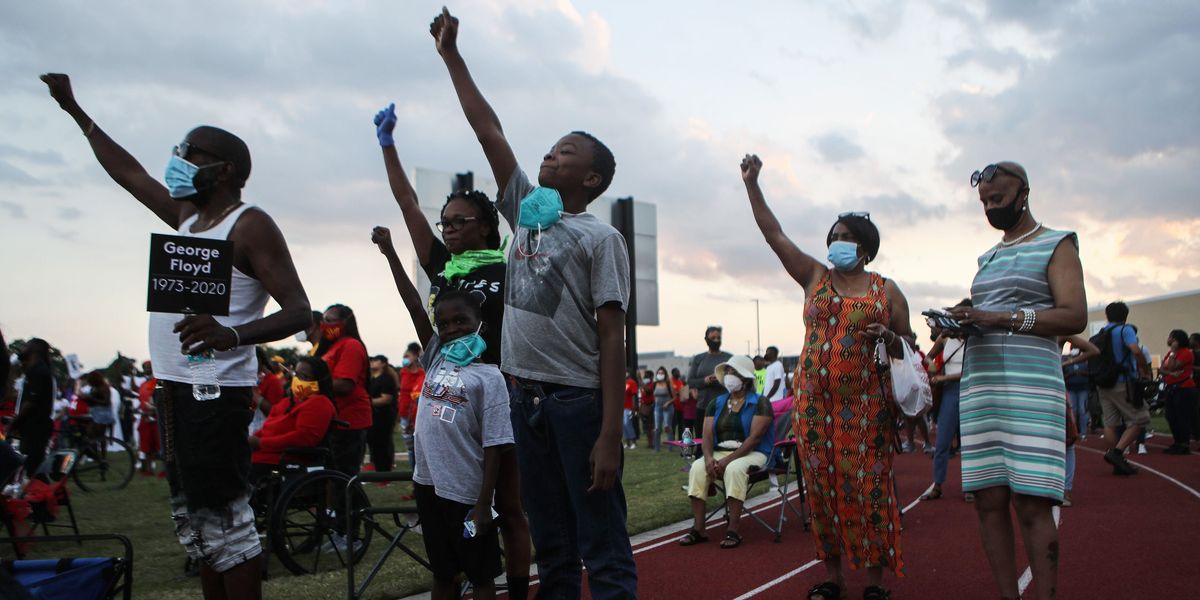 Houston High school alumni attend a vigil for George Floyd