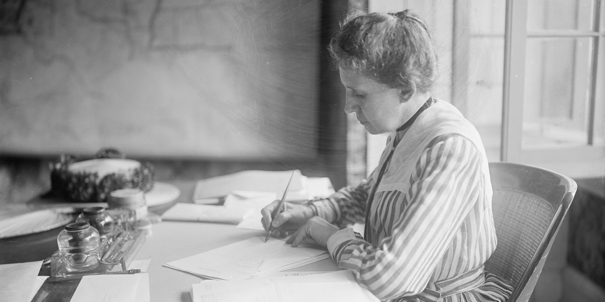 Ida Tarbell working at a desk