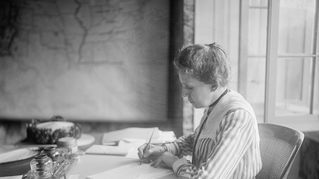 Ida Tarbell working at a desk