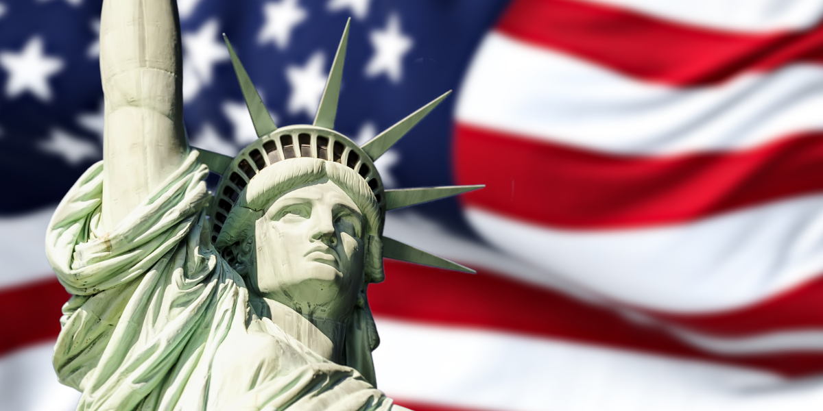 image of Statue of Liberty and American flag.