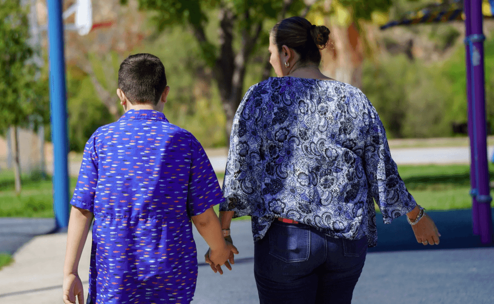 J.J. Nevares and his mother, Nidia Nevares, at the Father Charles M. McNaboe Park.