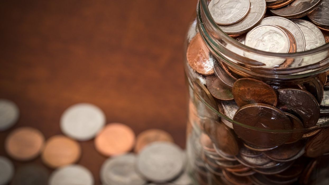 Jar full of american coins.