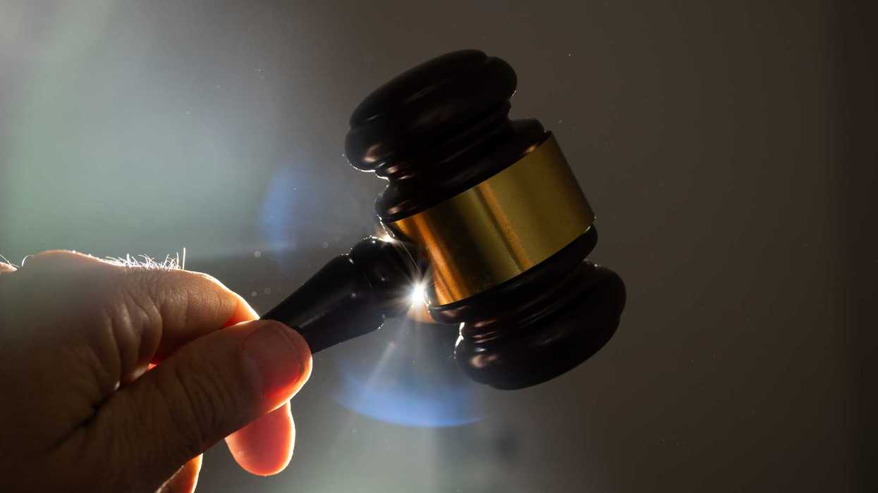 Judge hitting gavel in court, concept of justice, law, and legal protection. Back lit