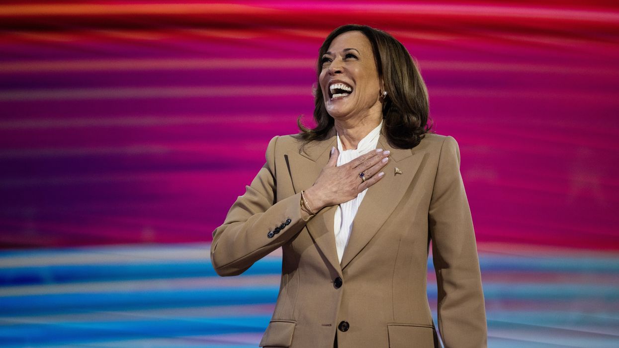 Kamala Harris with her hand over her heart