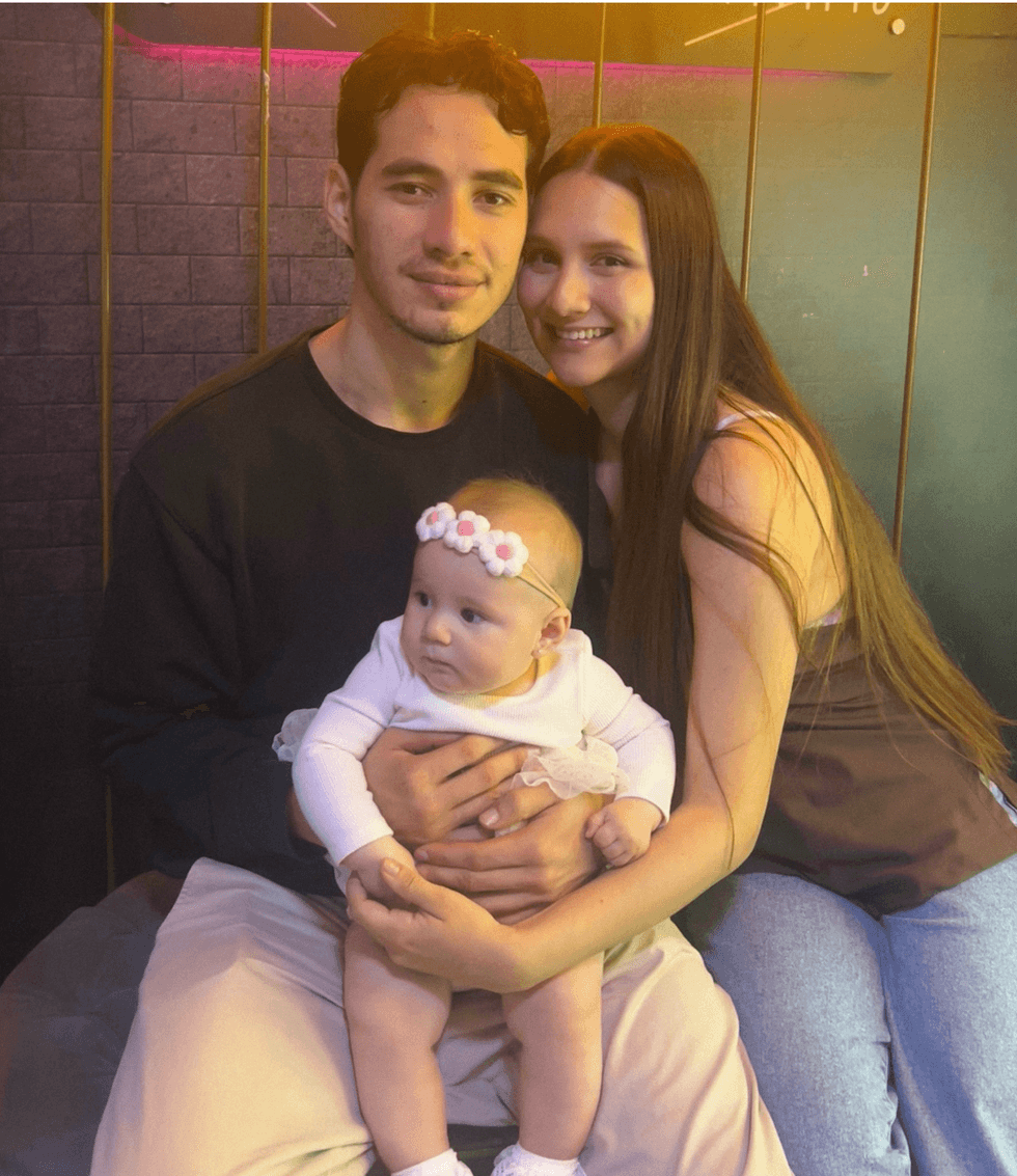 Kimberly Alvarez, 25, with her daughter Evangeline and her husband John Alvarez in Medellin, Colombia.