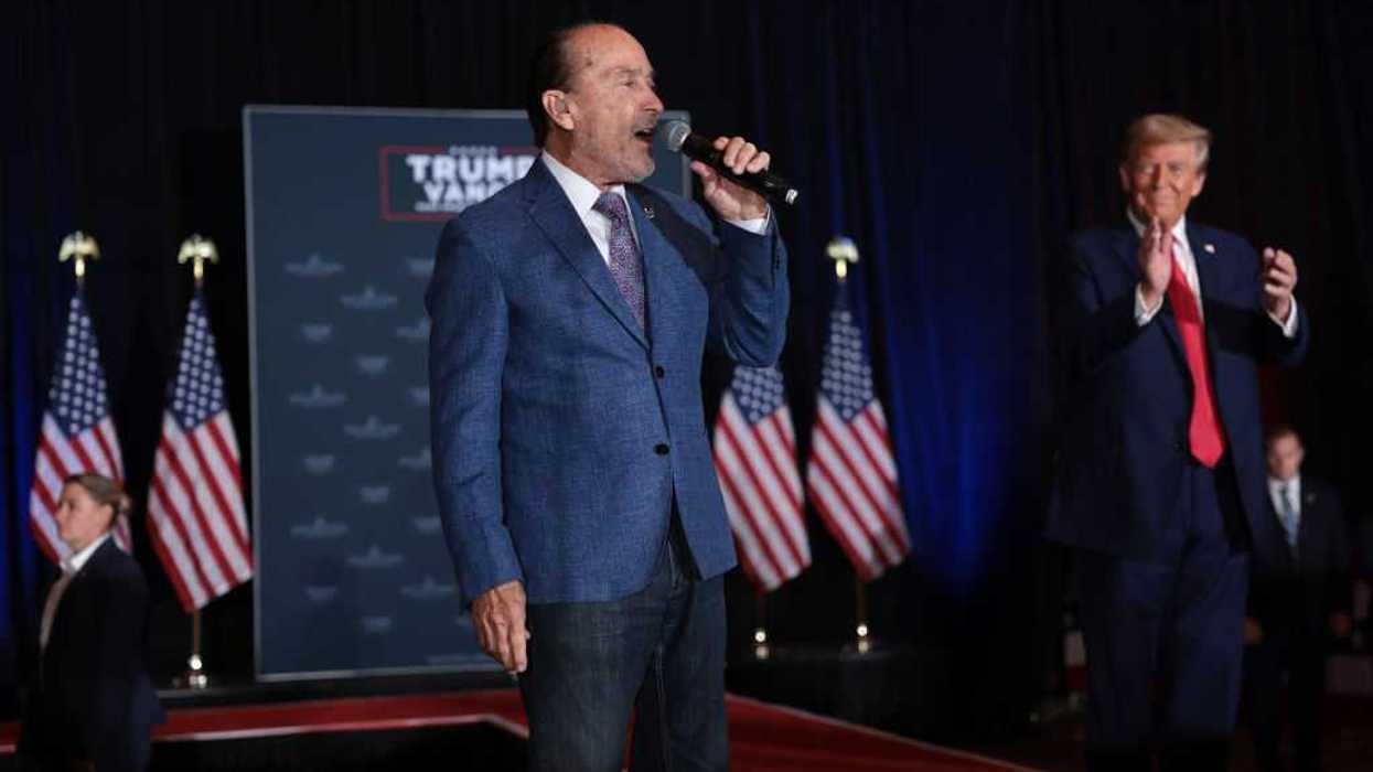 Lee Greenwood sings alongside President Donald Trump,