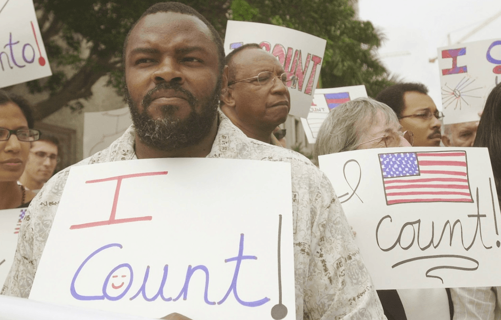 Leroy Jones, who served his sentence 10 years ago, protests outside a Miami courthouse