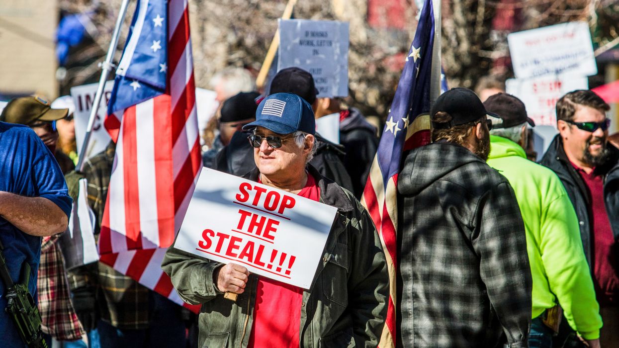 Man holding a "Stop the Steal" sign