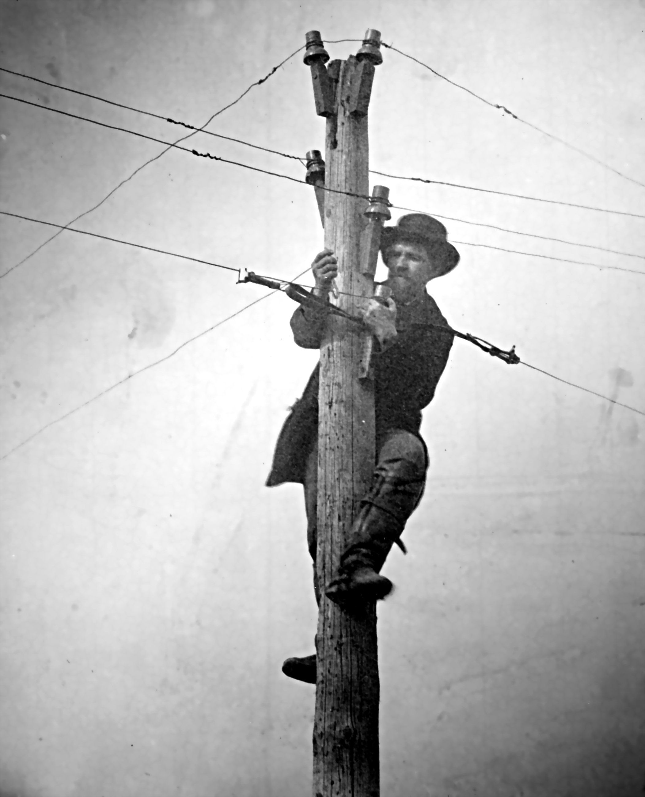 https://thefulcrum.us/media-library/man-maintaining-telegraph-wire.jpg?id=50994677&width=2105&height=2600&quality=85&coordinates=0%2C0%2C0%2C0