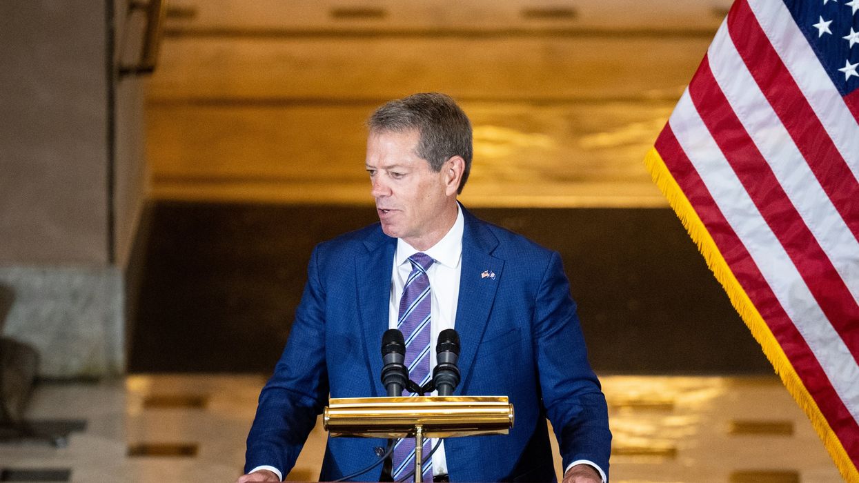 Man speaking at a podium