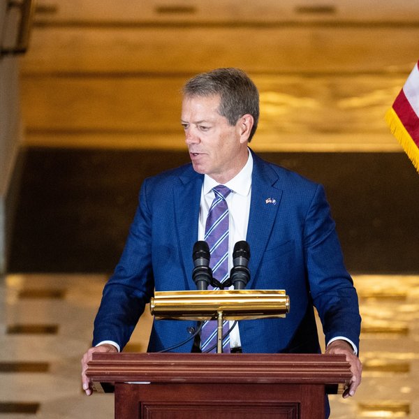 Man speaking at a podium